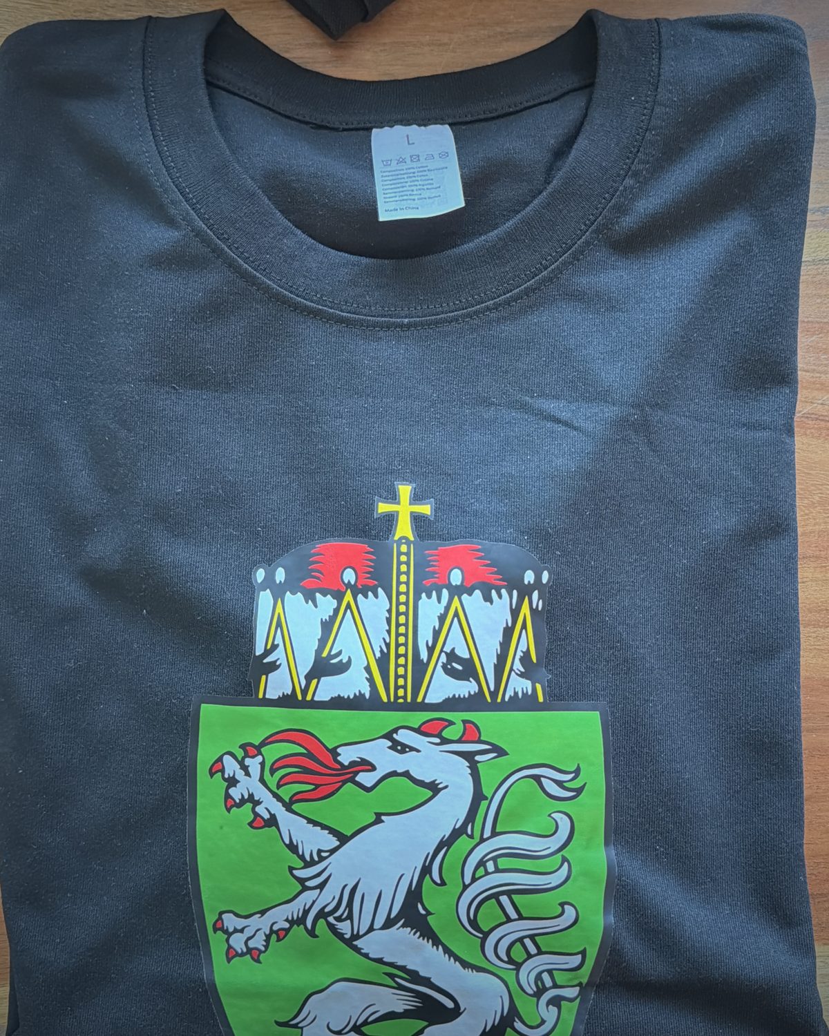 Black cotton T-shirt with the Styrian panther crest print on the front