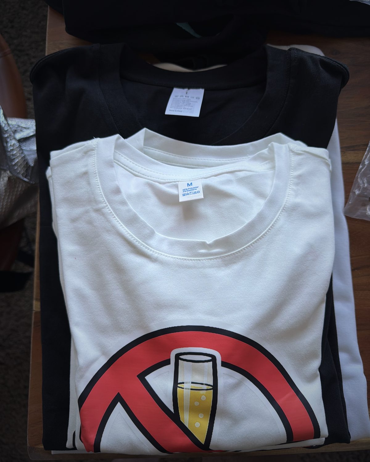 White crop top with a large red no-flute signet centered