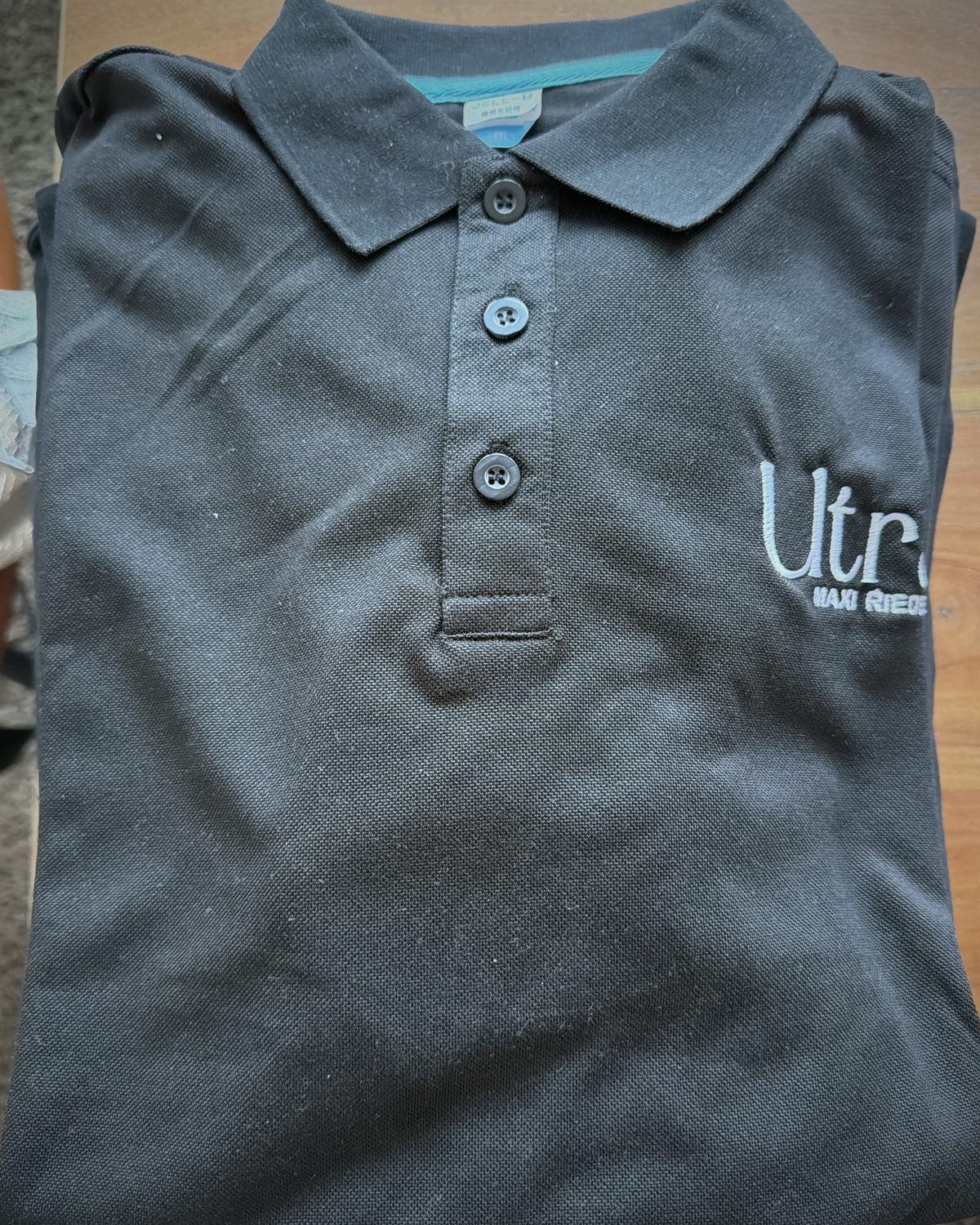 Black pique polo with embroidered Ultras / MAXI RIEDEL on the chest