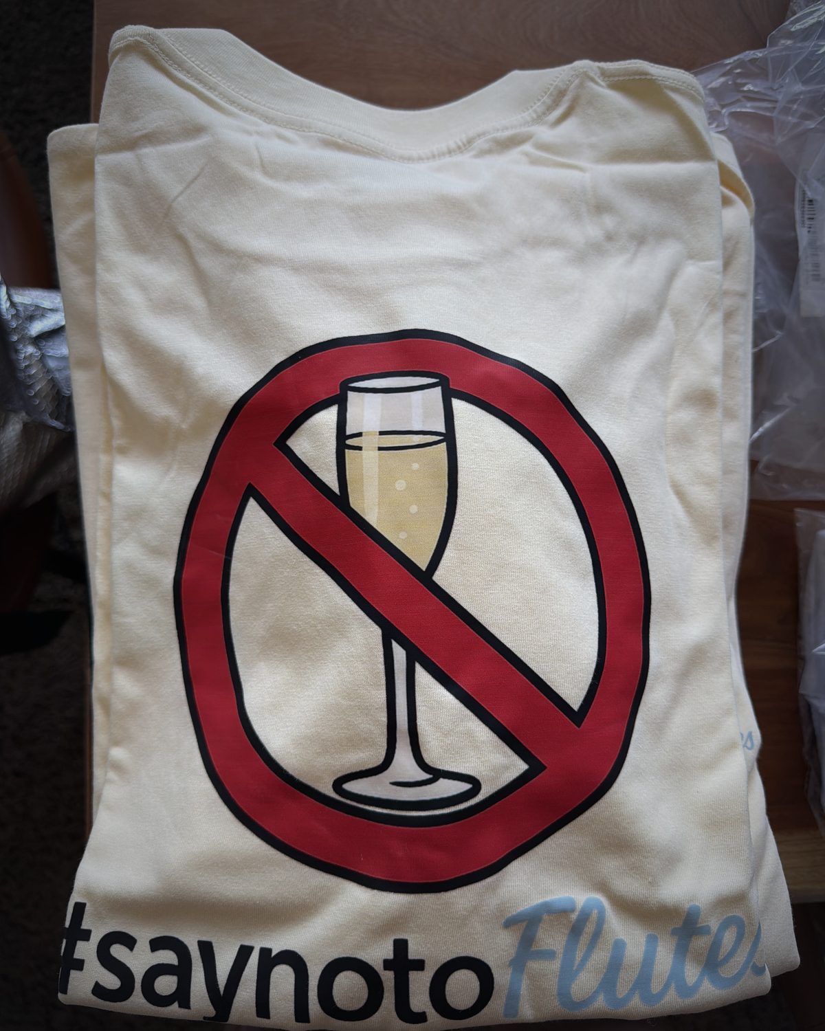 Apricot T-shirt with the Say No To Flutes signet on the front