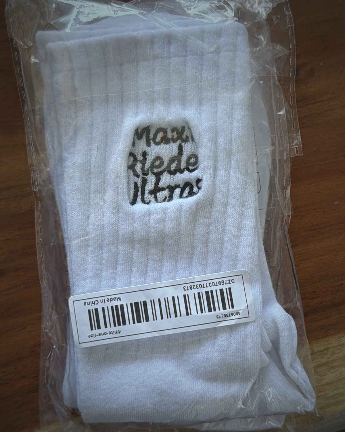 White socks with maxi riedel ultras script embroidered on the cuff